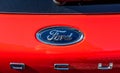 Ford logo on the back of a race red Ford Focus.. Royalty Free Stock Photo