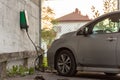 Gothenburg, Sweden - May 17 2021: Nissan Leaf electric car charging by a wallbox.. Royalty Free Stock Photo