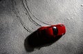 Top view of a red Porsche 911 model car in snow.. Royalty Free Stock Photo