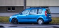 Blue Skoda Roomster parked on a street..