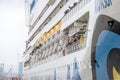 Passengers of a large cruise ship looking to shore as the ship departs.. Royalty Free Stock Photo