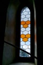 Gothic arch with window glazing in the old way in lead grids that