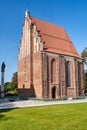 Gothic brick chapel and statue on a column i