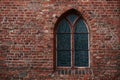 Gothic brick wall with a window