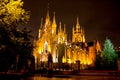 Gothic cathedral at night lit by lanterns