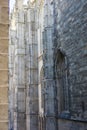 gothic cathedral side wall stone flying buttresses light and dark texture medieval religious architecture concept of Royalty Free Stock Photo