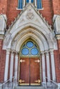 Gothic Church Entrance with Stained Glass and Stone Columns Royalty Free Stock Photo