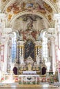 Gothic church interior full of decorations and paintings with altar for mass Royalty Free Stock Photo