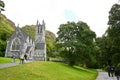 People visiting the Neo-Gothic church at Kylemore Estate, west of Ireland Royalty Free Stock Photo