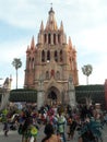 Gothic church with Palm trees native celebration  San Miguel de Allende Guanajuato Mexico Parroquia Royalty Free Stock Photo