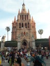 Gothic church with Palm trees native celebration  San Miguel de Allende Guanajuato Mexico Parroquia Royalty Free Stock Photo