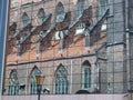 Gothic church reflected in modern glass elevation. Royalty Free Stock Photo