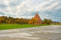 Gothic church in Zapyskis Lithuania, historic heritage site, autumn landscape with stormy sky Royalty Free Stock Photo