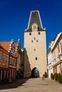 Gothic clock tower Mikulov Gate, Narrow picturesque street with colorful renaissance and baroque buildings in historic center in