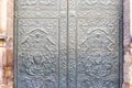 Gothic door with a bas relief and decorative ornament. Middle age church in Valencia Royalty Free Stock Photo