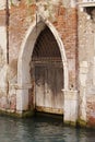 Gothic doorway on canal, venice Royalty Free Stock Photo