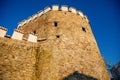 Gothic Fortress walls with a flag on top in winter sunny day  Medieval fortifications  historical and architectural monument Royalty Free Stock Photo