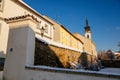 Gothic Fortress walls in winter day  tower of church of Nativity of the Blessed Virgin Mary  Medieval fortifications Royalty Free Stock Photo