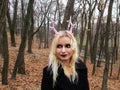 Gothic girl in New Year`s hoop with deer horns in the forest Royalty Free Stock Photo