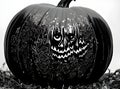 Gothic Halloween pumpkin hyperrealistic blackandwhite medium shot.