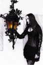 Gothic lady with lantern Royalty Free Stock Photo