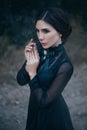 Gothic lady from an old fantasy horror movie. Beautiful vampire hunter. Royalty Free Stock Photo