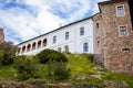 Gothic medieval castle Velhartice, sunny day, white mansion, facade with arches, masonry wall, old stronghold with tower, Royalty Free Stock Photo