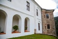 Gothic medieval castle Velhartice, sunny day, white mansion, facade with arches, masonry wall, old stronghold with tower, Royalty Free Stock Photo