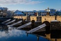 Gothic medieval Stony Deer bridge with show Riverbank of the Otava river in winter sunny day the oldest bridge in historical