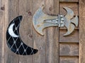 A gothic metal hinge and crescent moon design on an old wood door Royalty Free Stock Photo