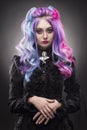 The gothic multi-colored hair girl on a gray background Royalty Free Stock Photo