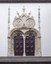Gothic portal door with Pinnacle decoration on white facade of churche in Ponta Delgada, Sao Miguel island, Azores