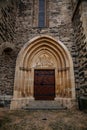 Gothic portal of medieval stone St. BartholomewÃÂ´s Church, architectural element of facade, decorative bas-relief details, Gothic