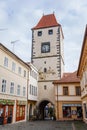 Gothic Prague Gate Tower, Medieval narrow old street with numerous cafes, colorful renaissance and baroque houses in Melnik, sunny Royalty Free Stock Photo