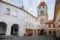 Gothic Prague Gate Tower, Medieval narrow old street with numerous cafes, colorful renaissance and baroque houses in Melnik, sunny Royalty Free Stock Photo