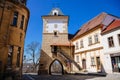 Gothic Priest`s Gate or Knezska brana, medieval fortification system, Medieval street, renaissance and baroque historical Royalty Free Stock Photo