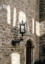 Gothic Quarter in Barcelona cityscape photo. Old brick wall and lantern. Street scene. Royalty Free Stock Photo