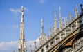 The gothic spiers in white marble on the roof of the Duomo cathedral. Milan, Italy