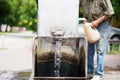 Gothic spigot installed on a flowing artesian wellhead. Selective focus. Royalty Free Stock Photo