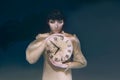 Gothic woman with clock in her hands in black veil underwater Royalty Free Stock Photo