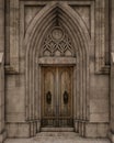 Gothic stone arch around old wooden door entrance to church or large house. 3D rendering Royalty Free Stock Photo