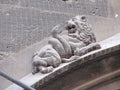 Gothic stone carving of lion and snake.