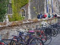 Gothic style stone college building with ivy in fall,