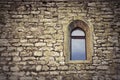 Gothic window on old castle wall Royalty Free Stock Photo