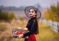 Gothic young girl holding pumpkins box Royalty Free Stock Photo