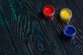 Gouache set for school. Tins of paint lie on pine boards Royalty Free Stock Photo