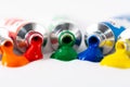 Gouache tube dripping paint and white background Royalty Free Stock Photo