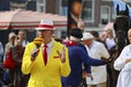 Actors playing the traditional cheese market in Gouda with presentor with cheese microphone