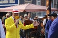 Actors playing the traditional cheese market in Gouda with presentor with cheese microphone