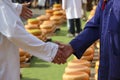 Actors playing the traditional cheese market in Gouda with farmer and buyer negotiation